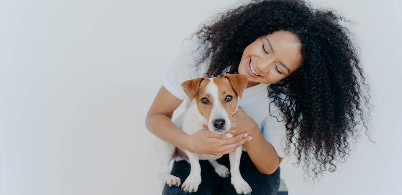 Woman holding a small dog